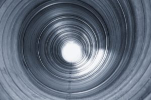 Abstract image of the inside of a cylindrical pipe.