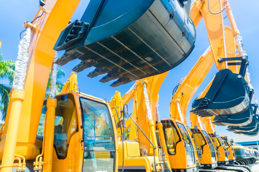 Heavy equipment parked and ready for use because of the metal manufacturing and metal fabrication industry.